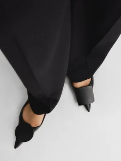 De Duelo platte slingbacks